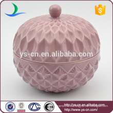 Recipiente de cerámica en relieve rosa con tapa para el hogar